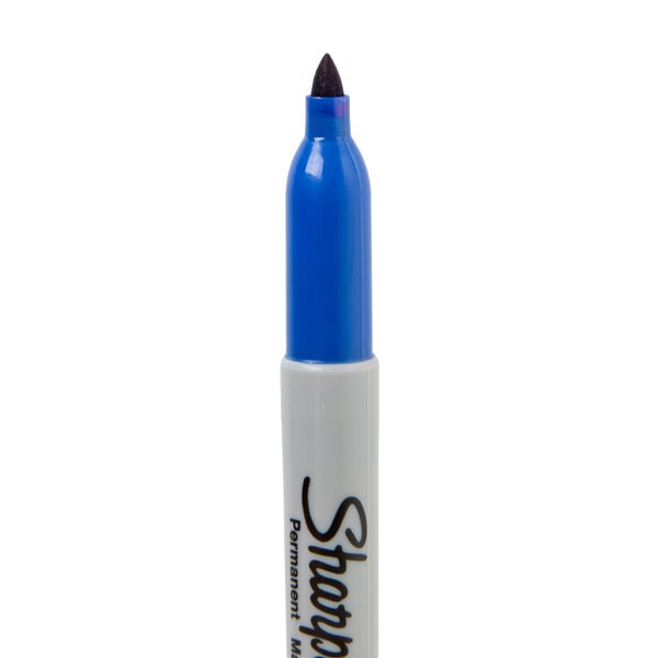 A blue Sharpie permanent marker with a white cap.