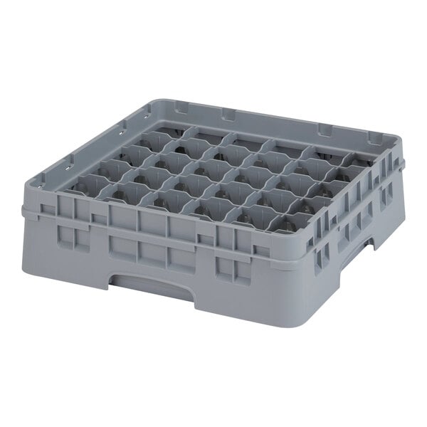 A grey plastic container with many compartments and holes.