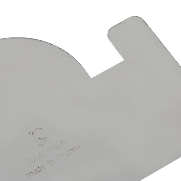 A close-up of a Matfer Bourgeat Buche cake comb with text on it.