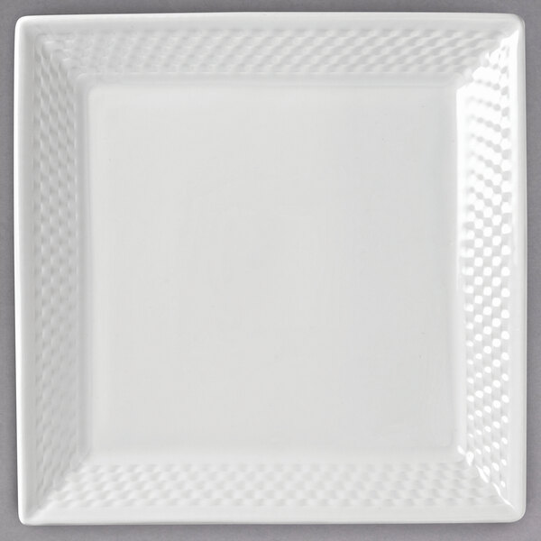 A white square Libbey porcelain plate with a textured square pattern.