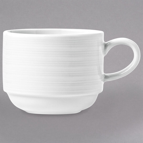 A white porcelain cup with a handle.