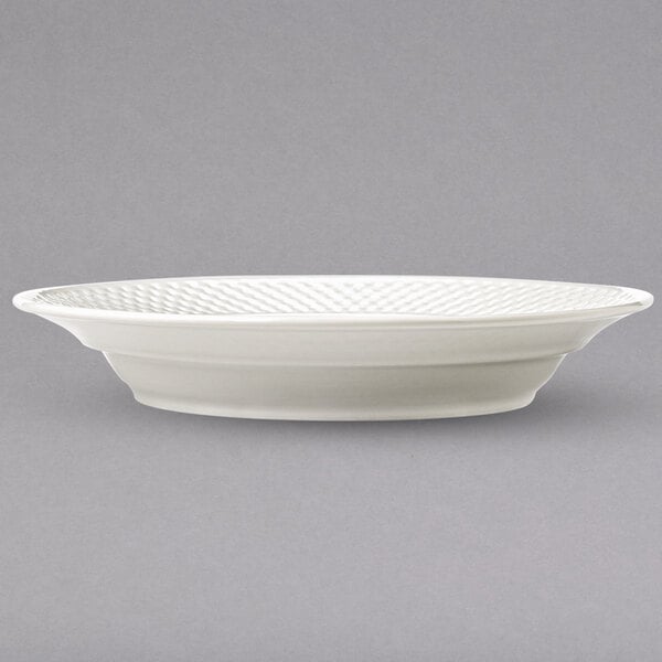 A white Libbey Lunar Bright white bowl with a constellation pattern on the rim.