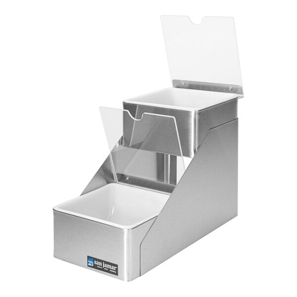 A San Jamar stainless steel 2-tier condiment bar with notched lids over two clear containers.