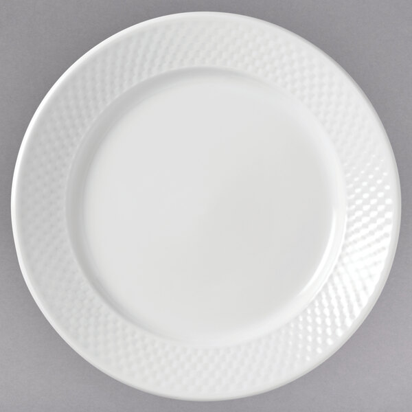 A white Libbey porcelain plate with a textured pattern.