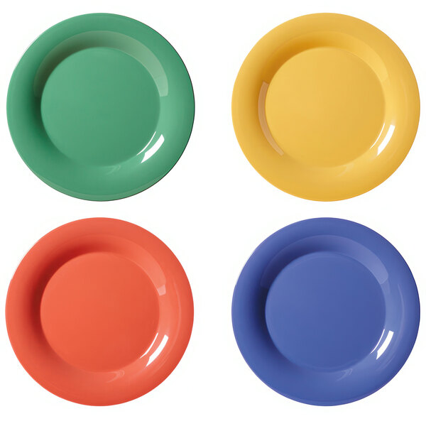 A group of colorful GET Diamond Mardi Gras melamine plates with different colors on them.