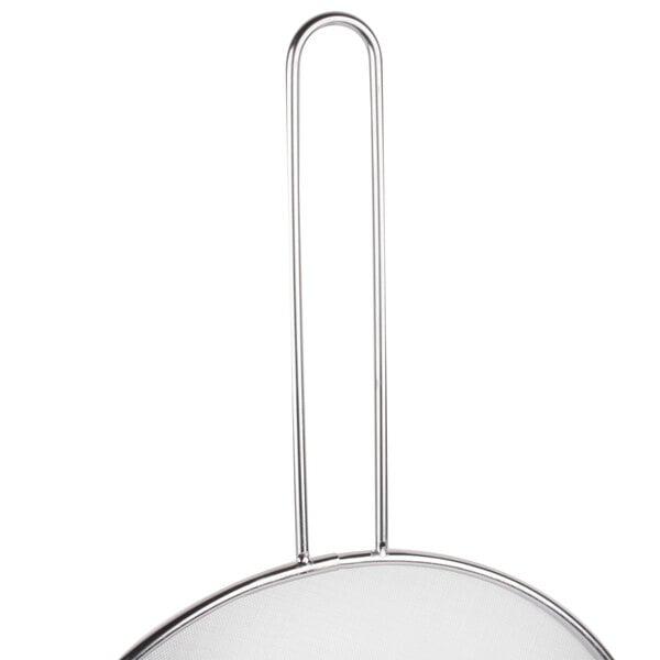 A silver metal Lodge splatter screen with a handle.