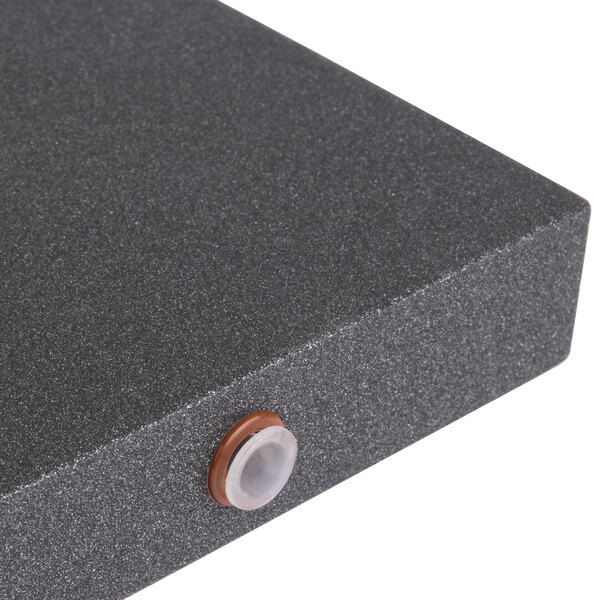 A black wood short crossbar with metal buttons on the ends.