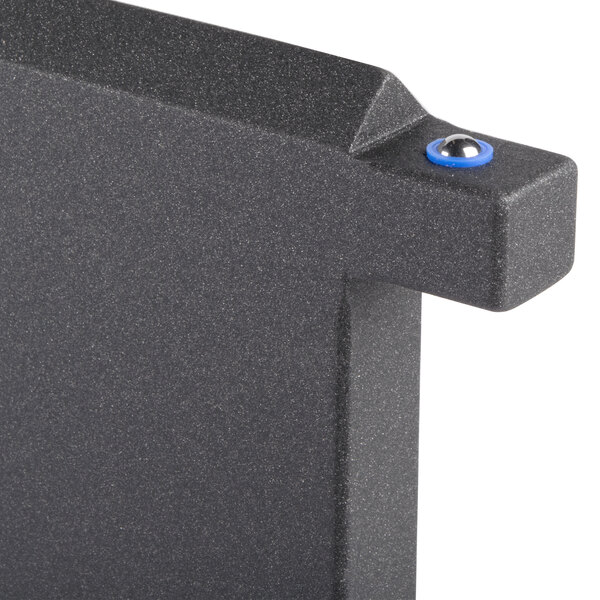 A black wood long crossbar on a black metal surface.