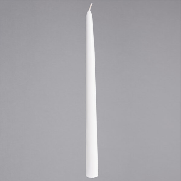 A long white Sterno taper candle on a gray background.