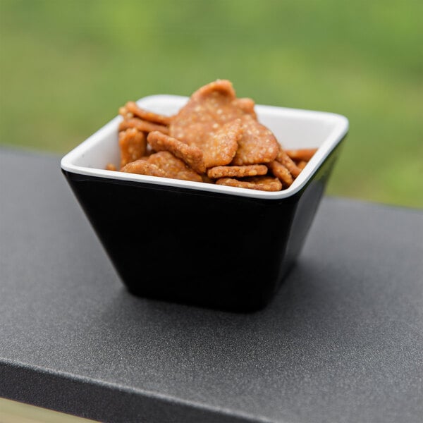 A white bowl of food on a table.