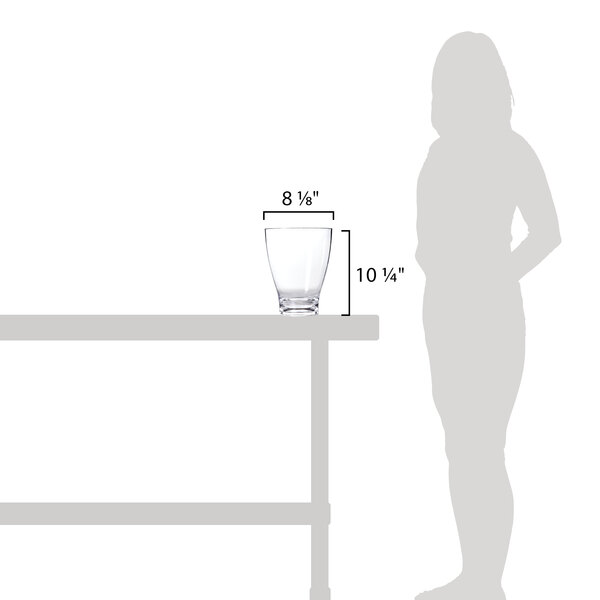 A Franmara Splendino acrylic wine cooler on a table with a glass of wine.