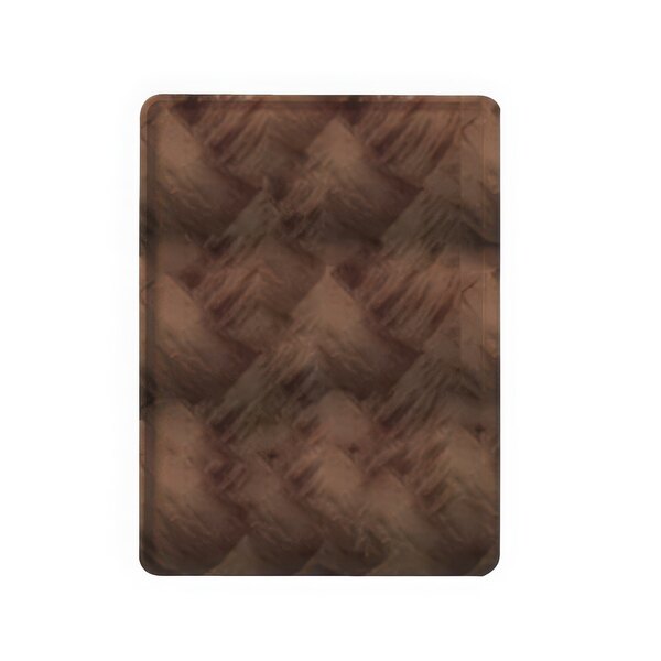 A close-up of a brown woven surface on a Cambro dark wood-look dietary tray.