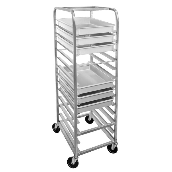 A metal shelf with white Channel pizza dough box trays on it.