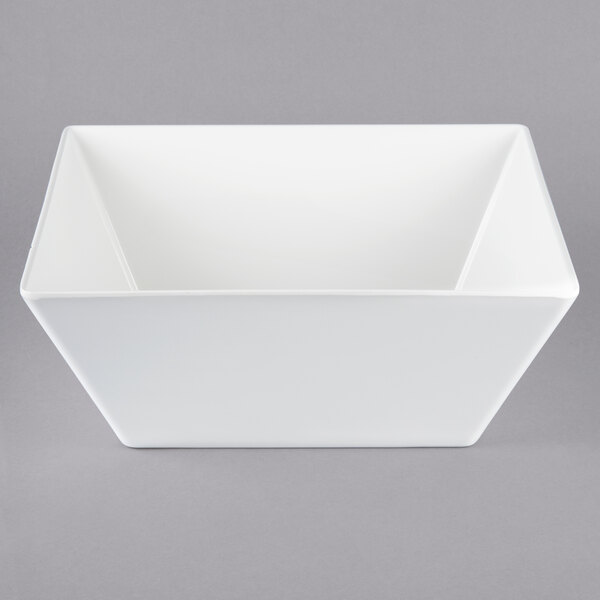 A white bowl on a gray background.