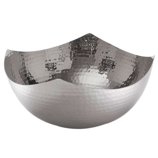 An American Metalcraft hammered stainless steel bowl with a wavy edge.