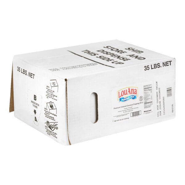 A large white cardboard box labeled 'LouAna Popcorn Oils' with a net weight of 35 lbs and dispensing instructions printed on the side.