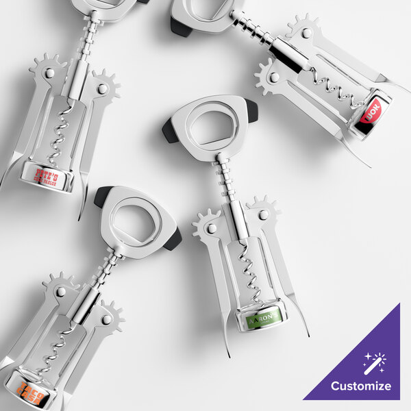 A set of chrome-plated wing corkscrews with customizable labels on the handles.