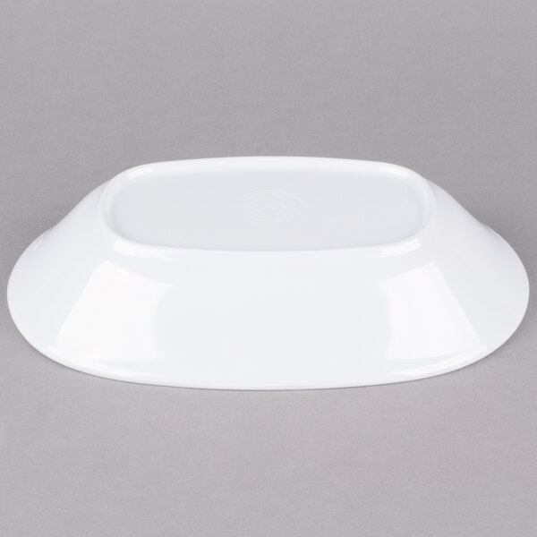 An American Metalcraft white melamine serving bowl on a gray surface.