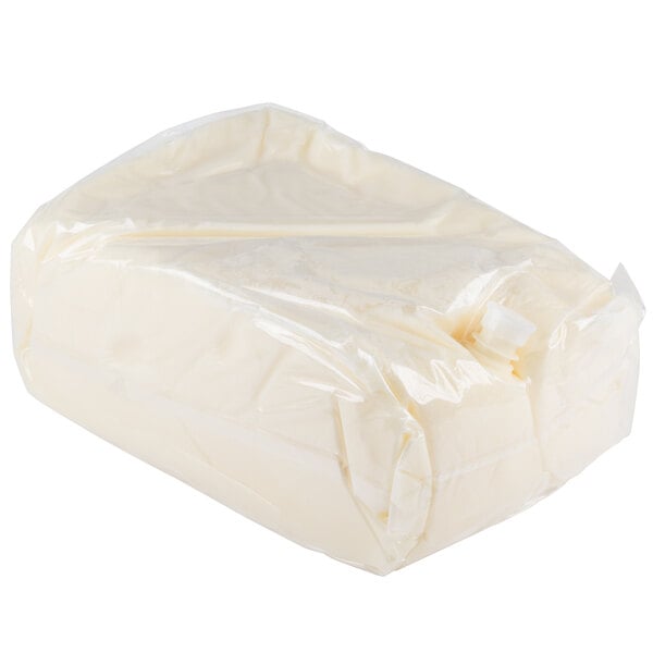 A bag of white liquid coconut oil inside a box.