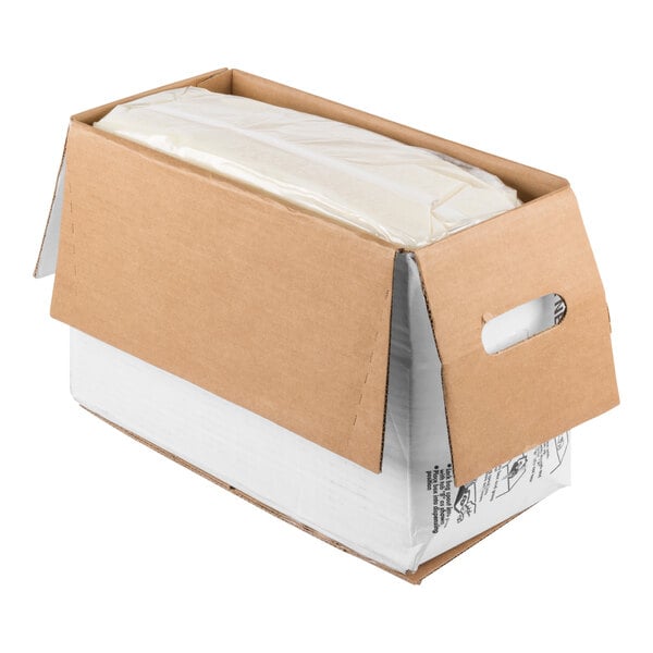 A cardboard box with partially open flaps revealing a large plastic bag filled with a white substance inside.