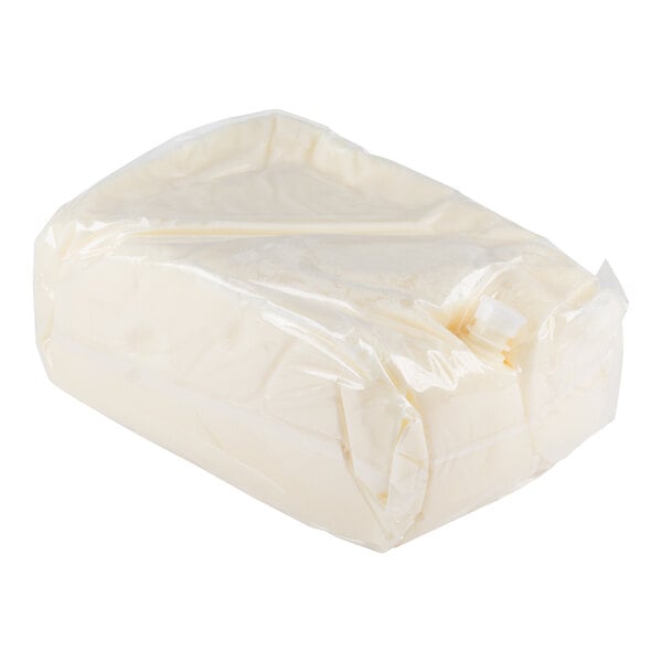 A large rectangular block of white substance wrapped in clear plastic.