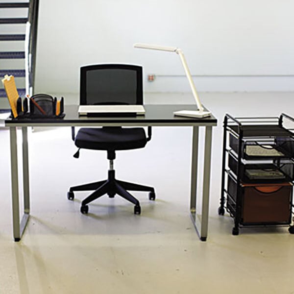 A Safco black and silver steel workstation with a laptop on the desk.