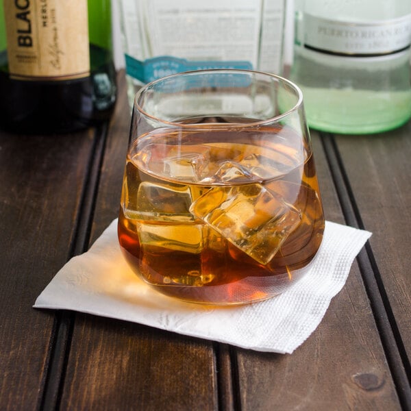 A Reserve by Libbey Prism double old fashioned glass filled with liquid and ice on a table.