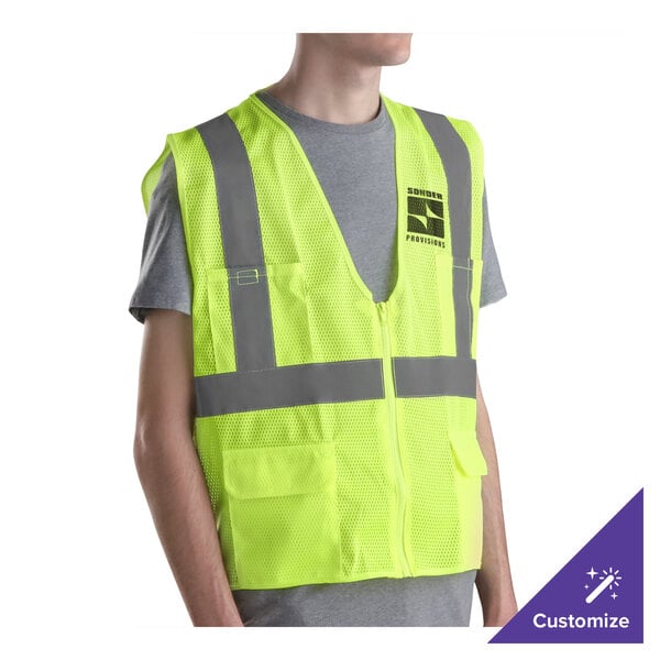 A person wearing a lime green Cordova Class 2 high visibility safety vest.