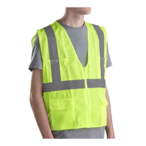 A man wearing a lime green Cordova High Visibility safety vest.