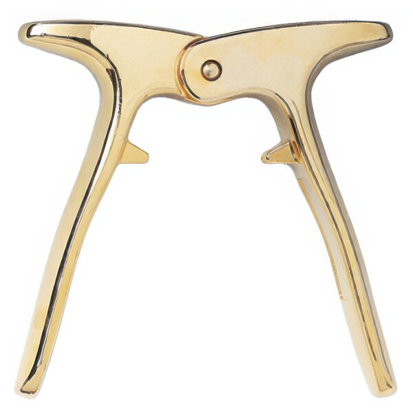 A gold-plated Franmara champagne opener with two legs.