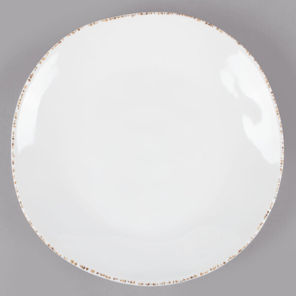 A white melamine bowl with brown speckled trim.