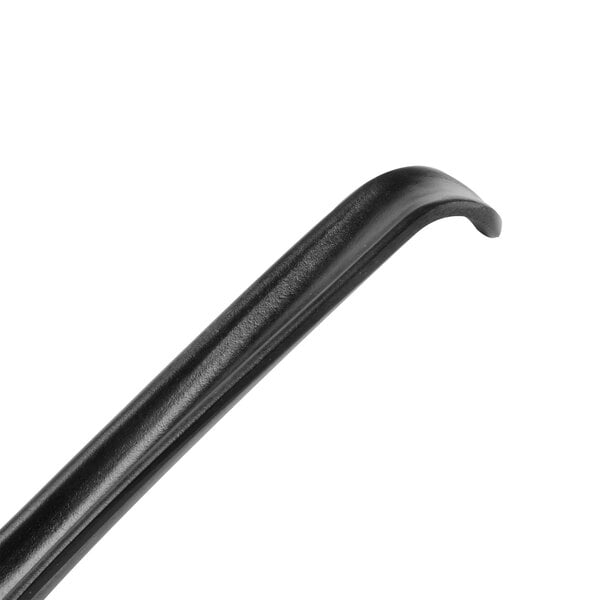 A close-up of a black curved soup spoon handle.