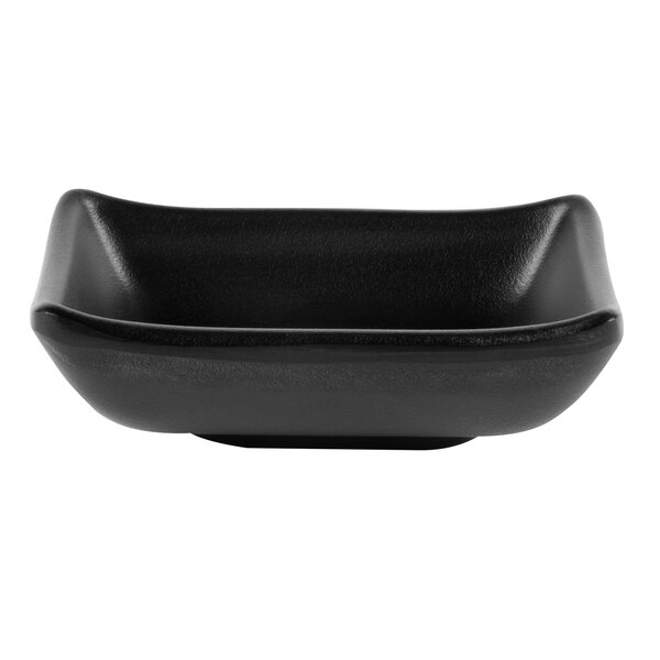 A black square GET Nara melamine sauce dish.