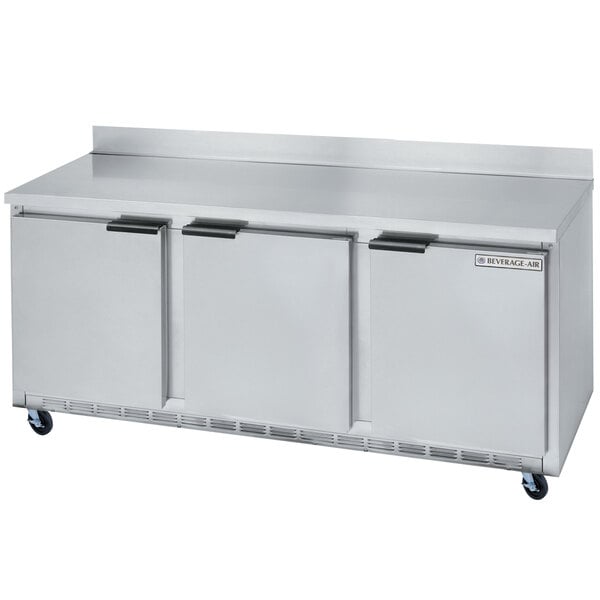 A large stainless steel Beverage-Air worktop refrigerator with three doors.