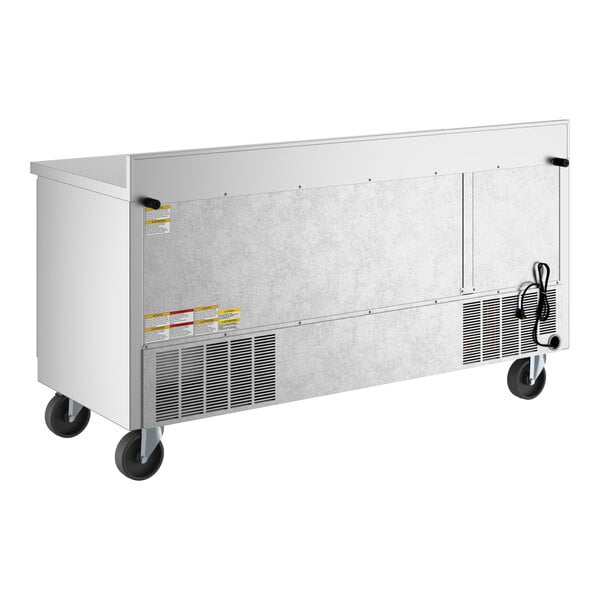 A large stainless steel three-door worktop refrigerator with a 4-inch foamed-in-place backsplash and casters for mobility.