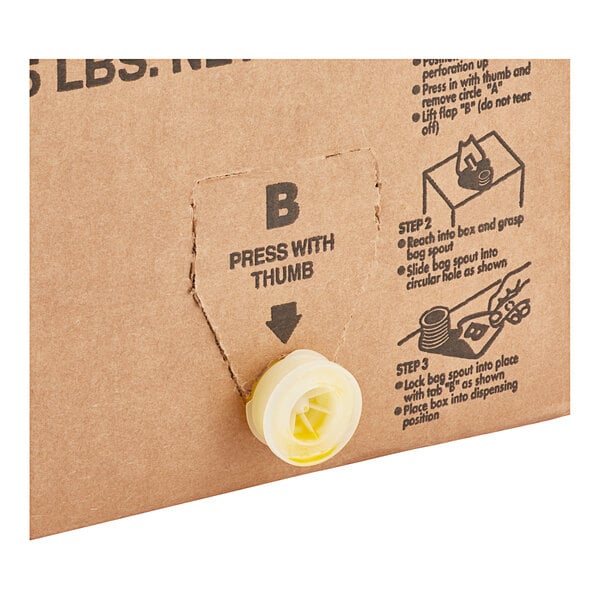 A LouAna cardboard box with a yellow button on it.