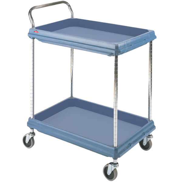 A Metro slate blue utility cart with two deep shelves and metal legs.