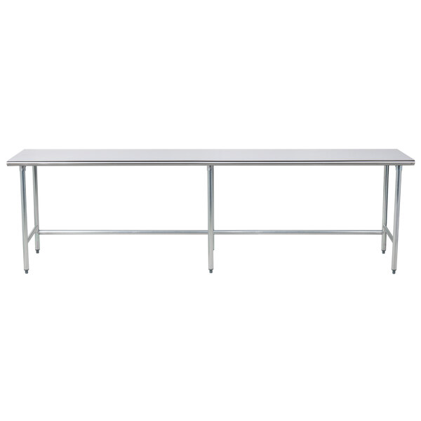 An Advance Tabco stainless steel work table with an open base and metal legs.