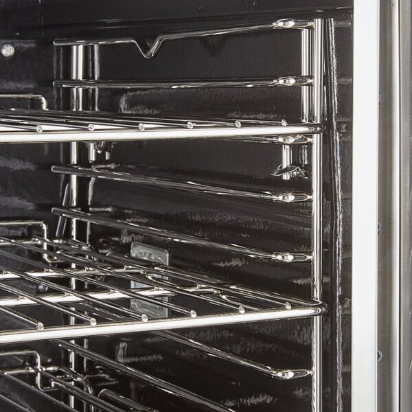 A stainless steel oven rack in a Cooking Performance Group double deck convection oven.