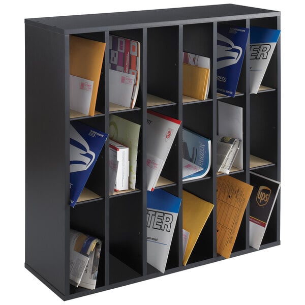 A black wood mail sorter with many different sections on a black shelf.