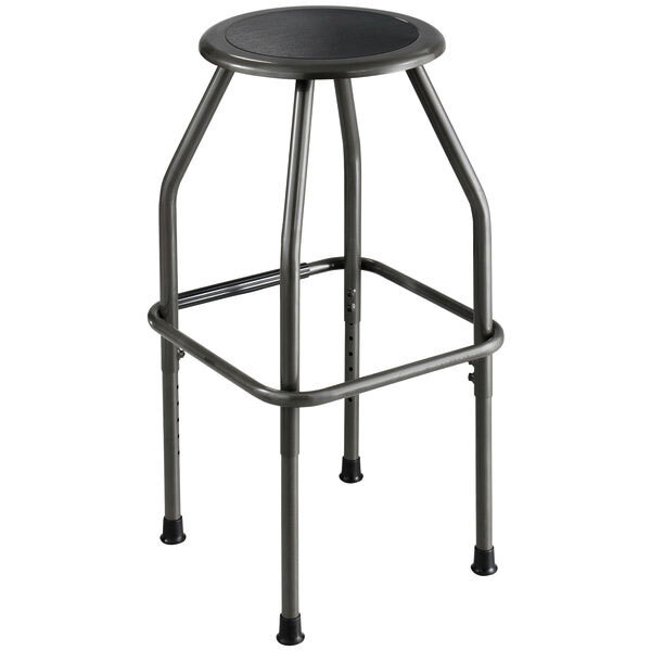 A Safco Diesel Series pewter steel industrial stool with a padded black seat and metal legs.
