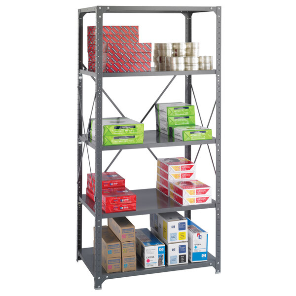 A Safco dark grey steel shelving unit holding many boxes.