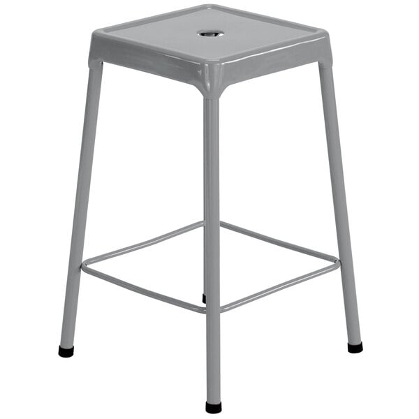 A Safco silver steel stool with grey legs and a seat.