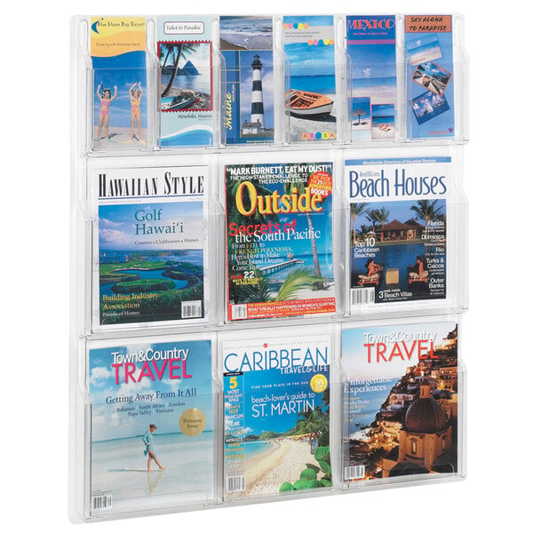 A Safco clear acrylic wall-mount magazine rack filled with magazines.