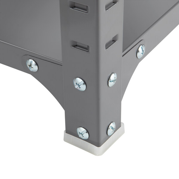 A Safco dark gray commercial steel shelving unit with screws and bolts.