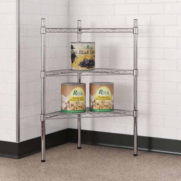 A chrome Regency wire shelf with cans of food on it.