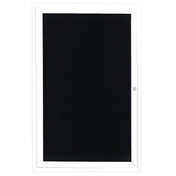 A white enclosed bulletin board with a black letter board and white frame.