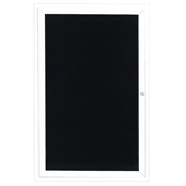 A white aluminum door with a black letter board inside with a white frame.
