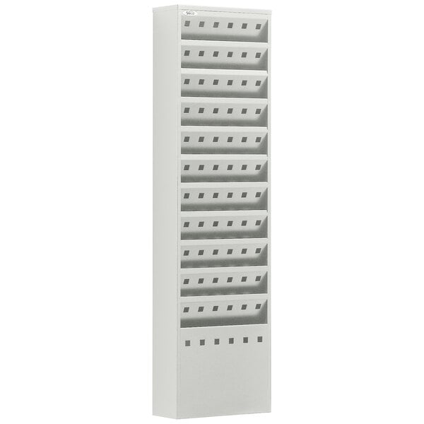 A gray wall mounted steel magazine display rack with 11 compartments.