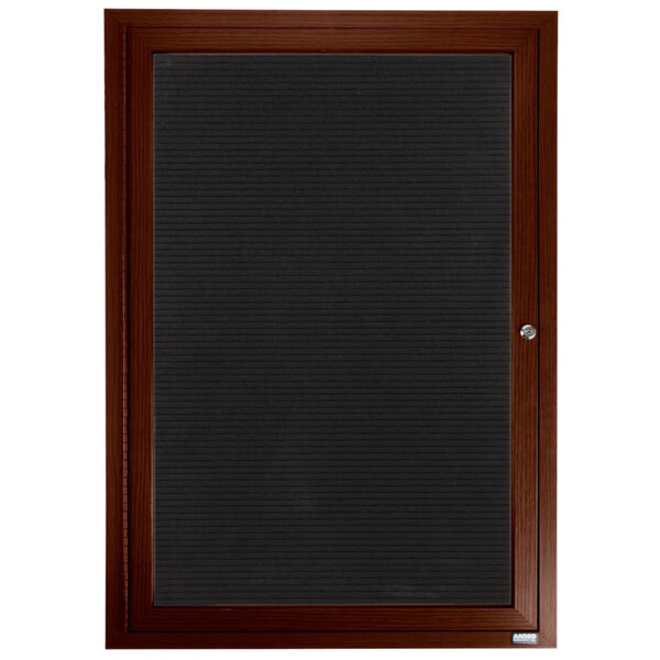An Aarco outdoor directory board with a walnut frame and black letter board inside.